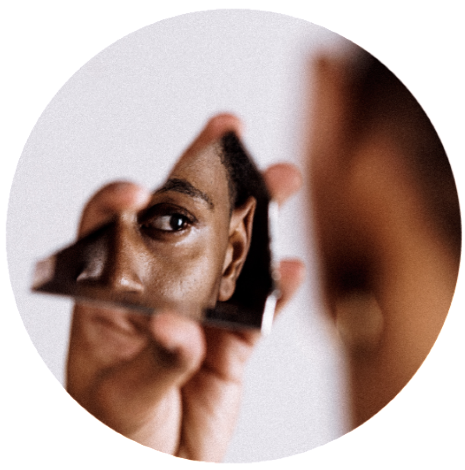 person holding mirror reflection of self cosmetic acupuncture service acupuncture in toronto naturopathic service