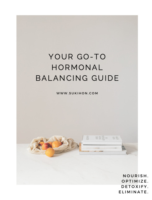 preview of hormone balancing guide with stacked books and a bag of fruits on the cover